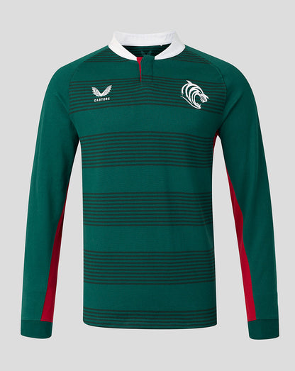A dark green long-sleeve rugby jersey with horizontal dark stripes, a white collar, red side panels, and white logos on the chest, displayed on a neutral gray background.