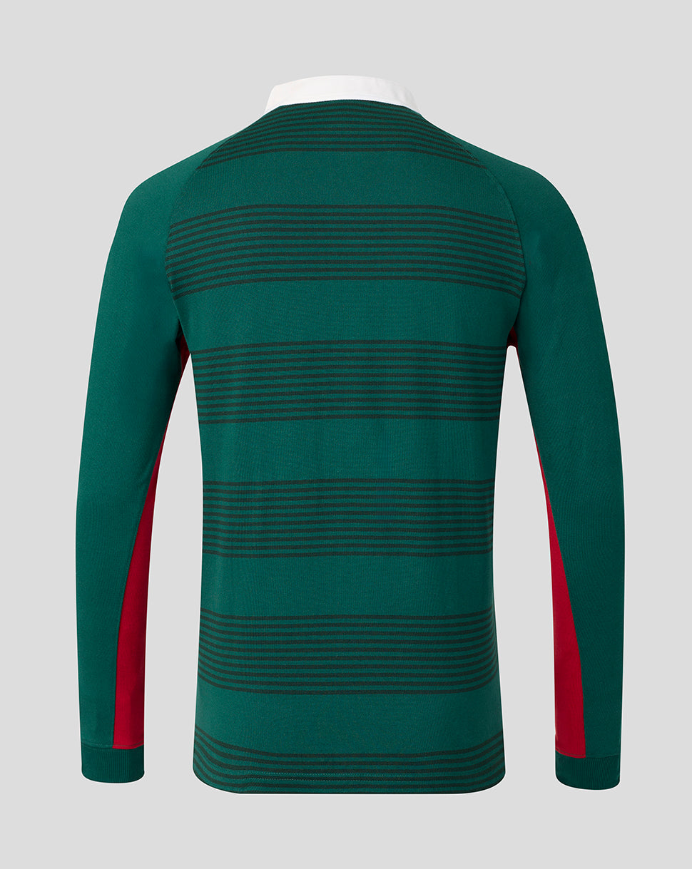 A long-sleeve knit top shown from the back, featuring horizontal dark green stripes on a dark green base with red side panels on the sleeves, displayed on a white mannequin torso against a light gray background.