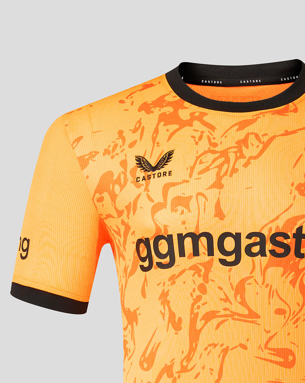 Close up of FC Twente 26/27 goalkeeper shirt in orange showing an abstract pattern and Castore branding on the collar