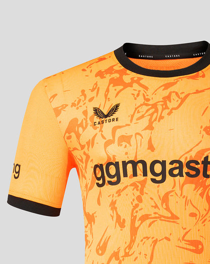 Close up of FC Twente 26/27 goalkeeper shirt in orange showing an abstract pattern and Castore branding on the collar