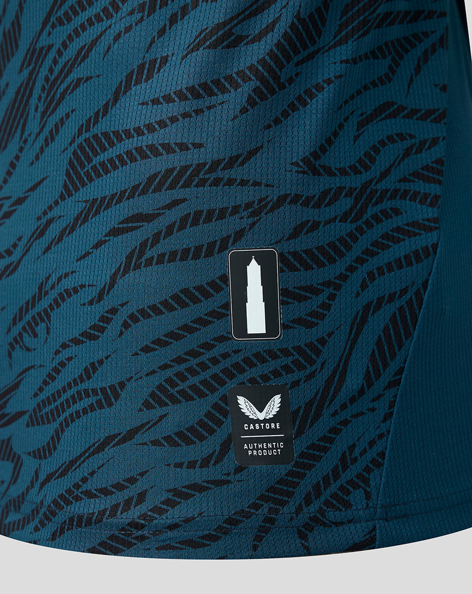 Close-up of teal away shirt showing tiger stripe pattern, FC Utrecht shield crest, and Castore authentic product patch.