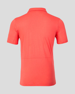 Red polo shirt on a gray background