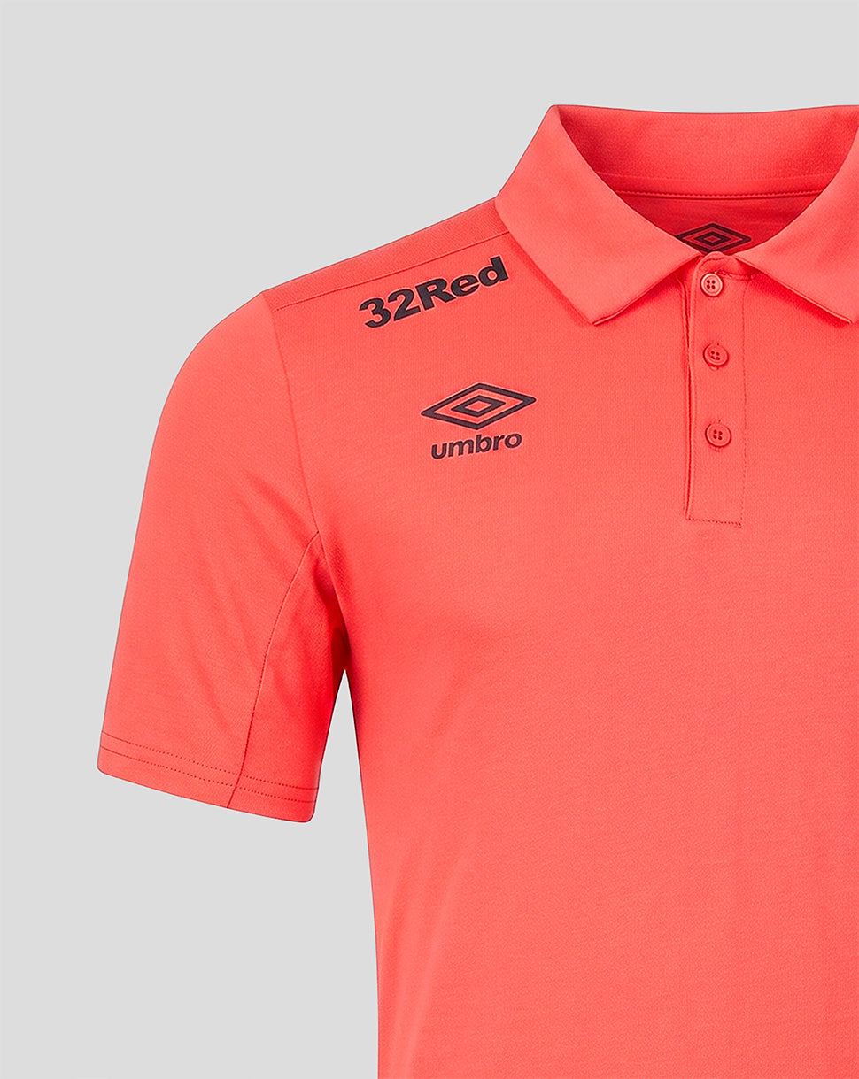 Orange polo shirt with '32Red' and Umbro branding on a gray background