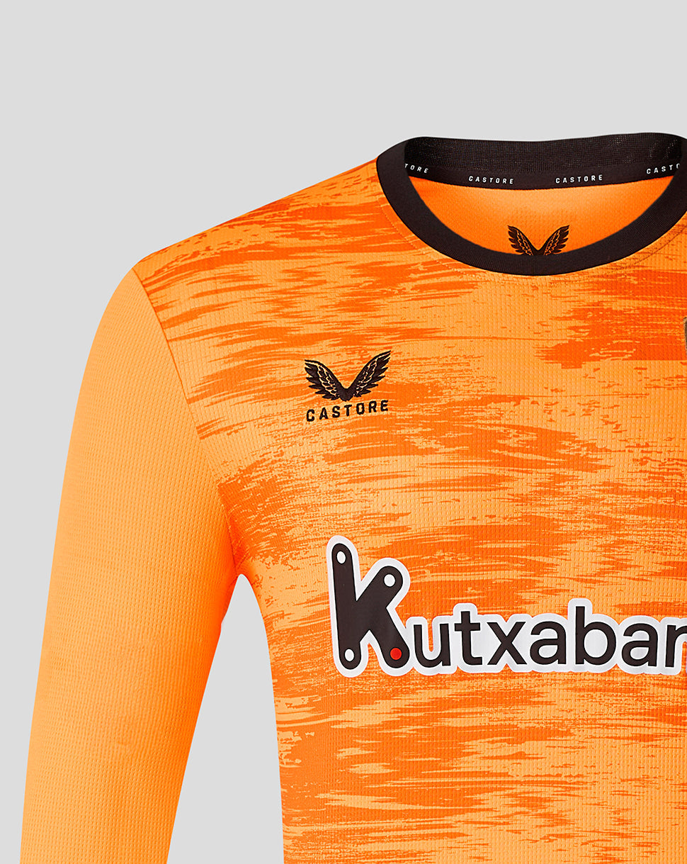 Close view of bright orange Athletic Club third goalkeeper long sleeve jersey front with crest on chest and Kutxabank sponsor.