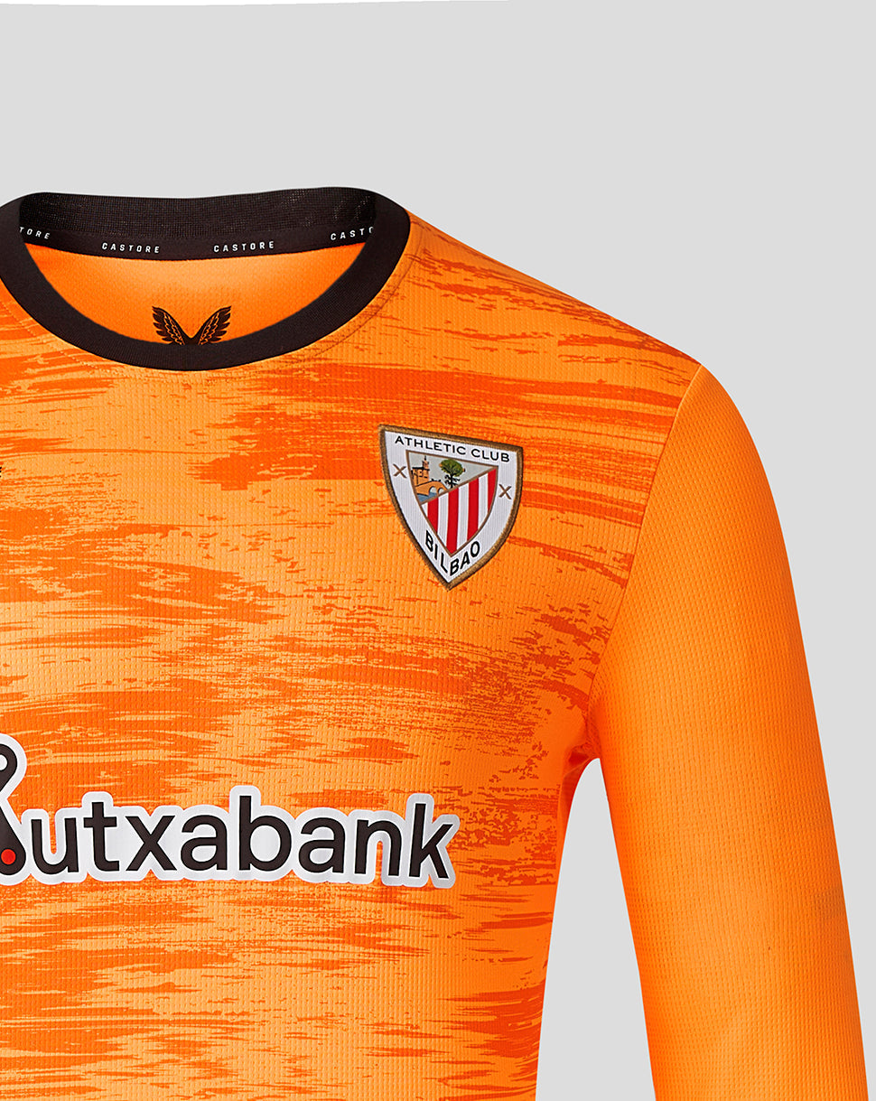 Close front view of orange Athletic Club third goalkeeper jersey with crest on chest and Kutxabank sponsor.