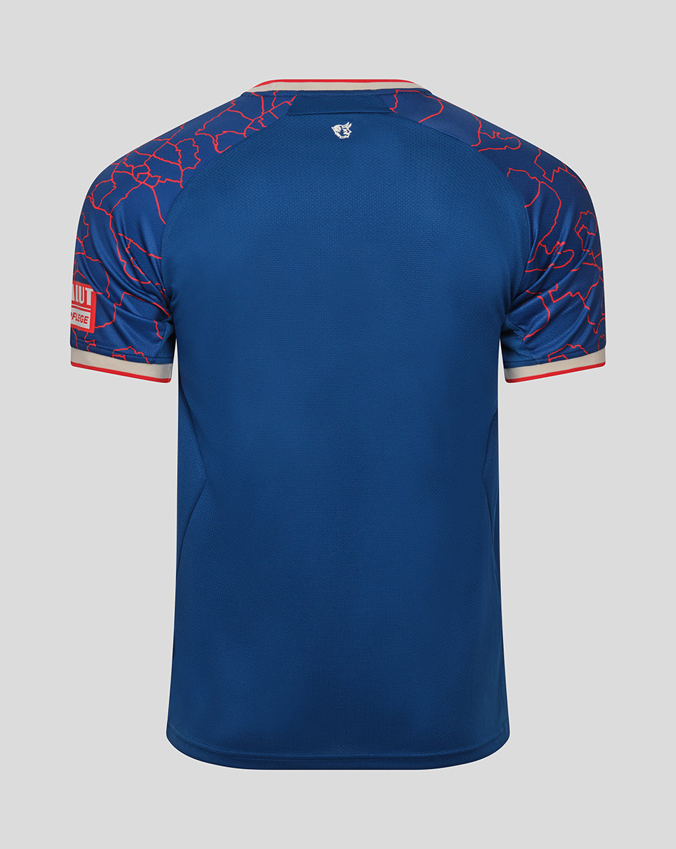 Back view of blue FC Kaiserslautern away shirt with a red map pattern on the sleeves, a small crest at the upper back, and beige and red trim at the collar and cuffs.