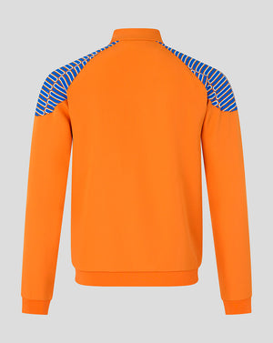 Bright orange long-sleeve quarter-zip sweatshirt shown from the back, featuring blue and white diagonal striped knit shoulder panels, on a light gray background.