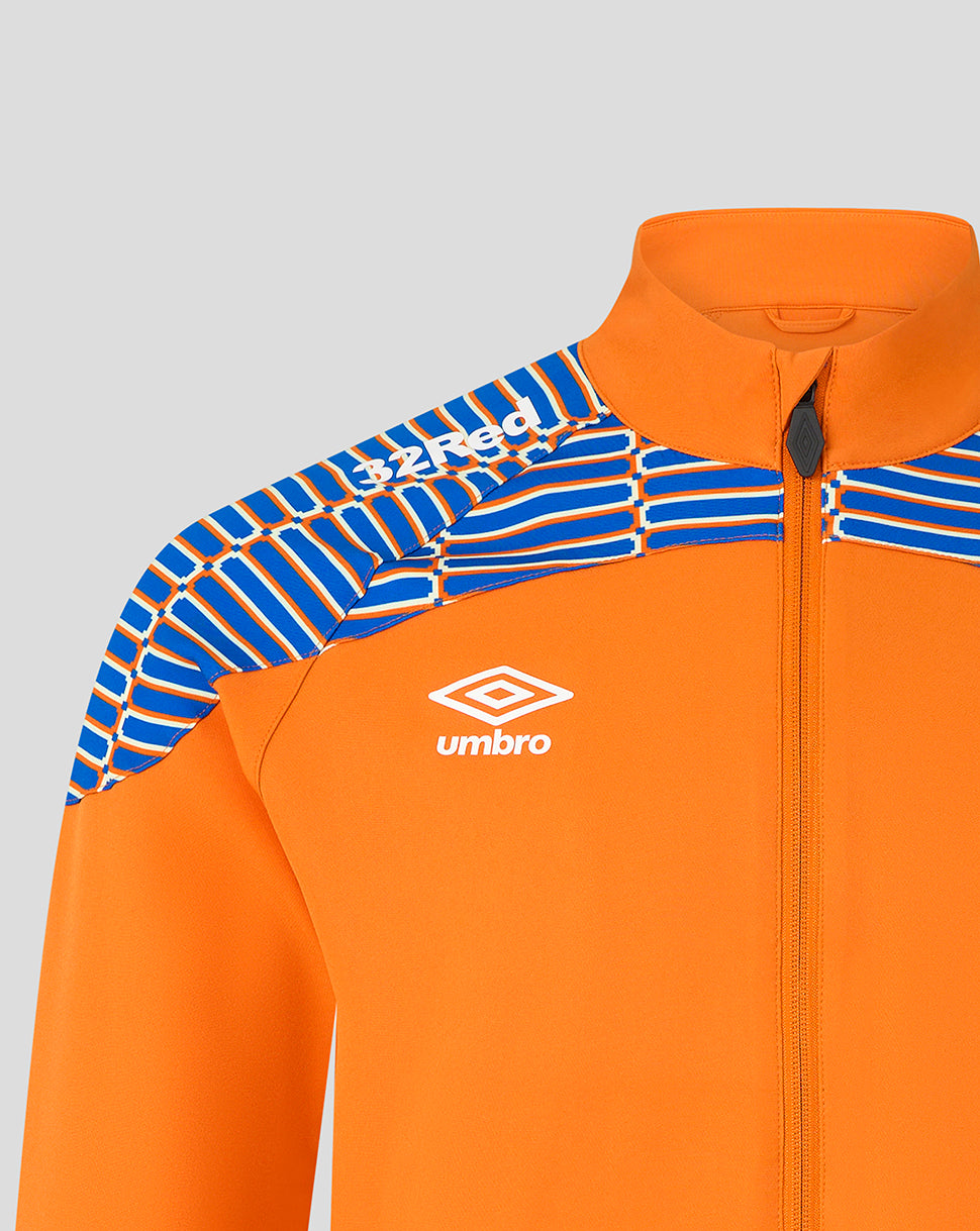 Close-up of an orange zip-up athletic jacket with blue and white patterned shoulder panels and a white Umbro logo on the chest, shown against a light gray background.