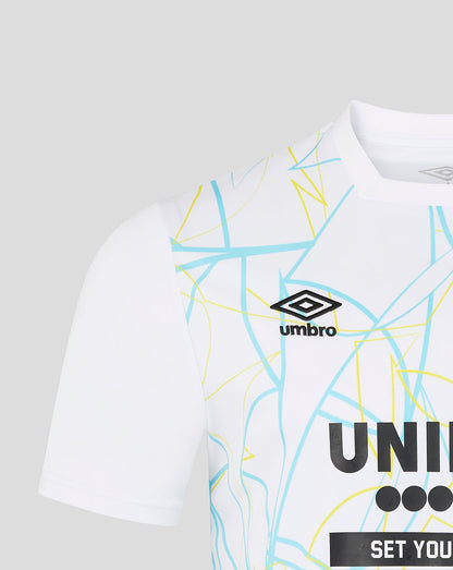 White t-shirt with geometric patterns and Umbro logo on a light gray background