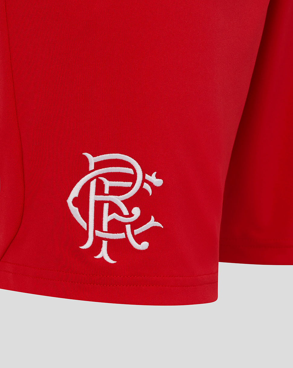 Red shorts with a white logo on a light gray background