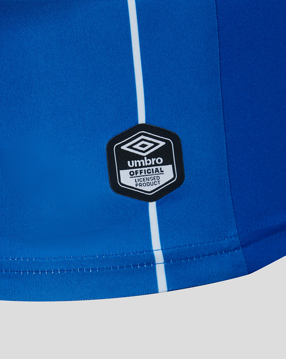Blue sports shirt with a visible Umbro logo on a white background