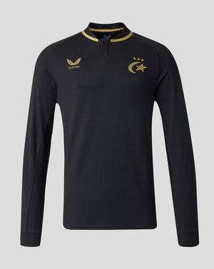 A black long-sleeve athletic quarter-zip pullover with gold accents, featuring the Saracens crescent and star emblem on the left chest, and the Castore brand logo on the right chest, shown against a solid gray background.