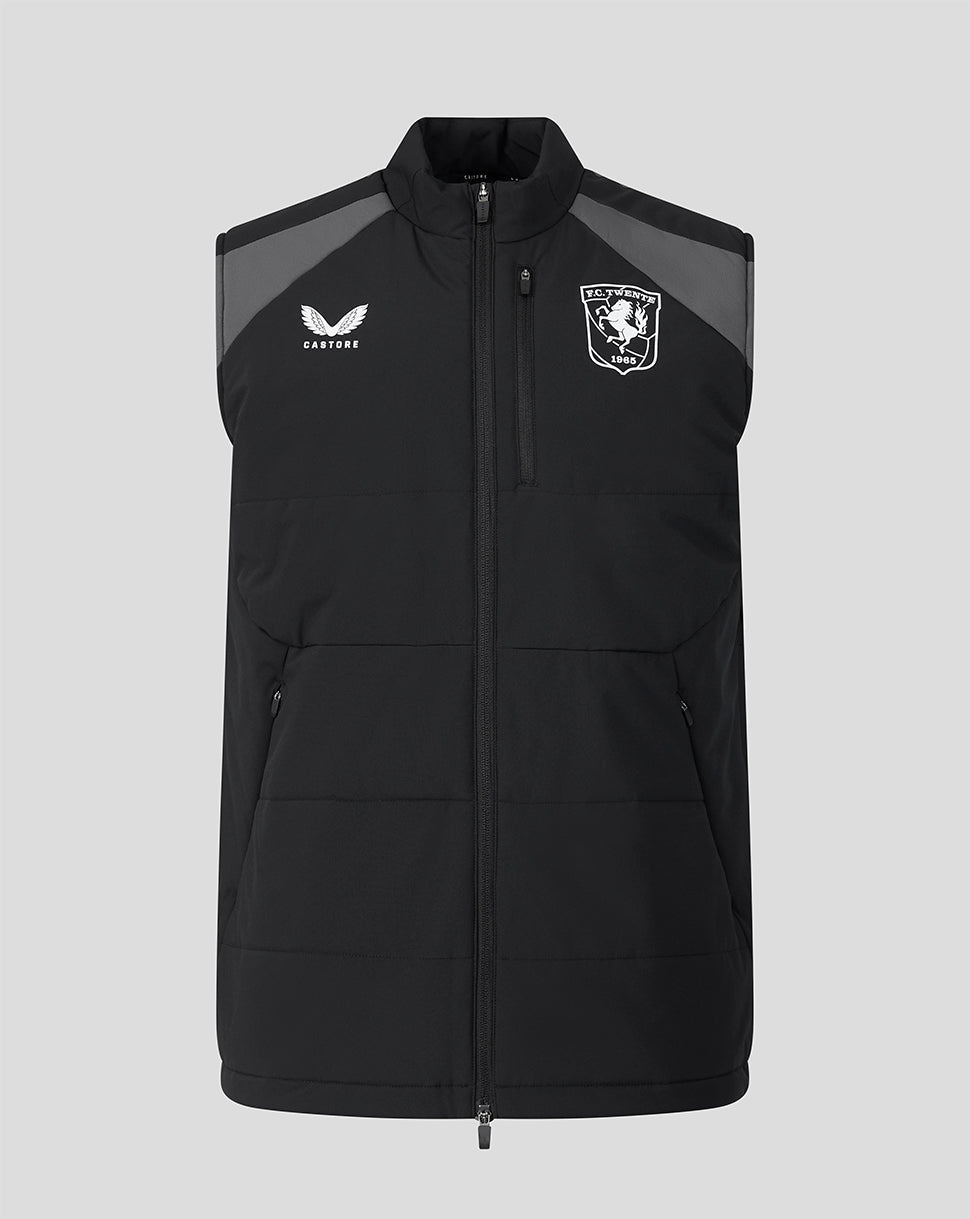 Front view of black FC Twente training gilet with gray shoulder panels, Castore logo on left chest and club crest on right.
