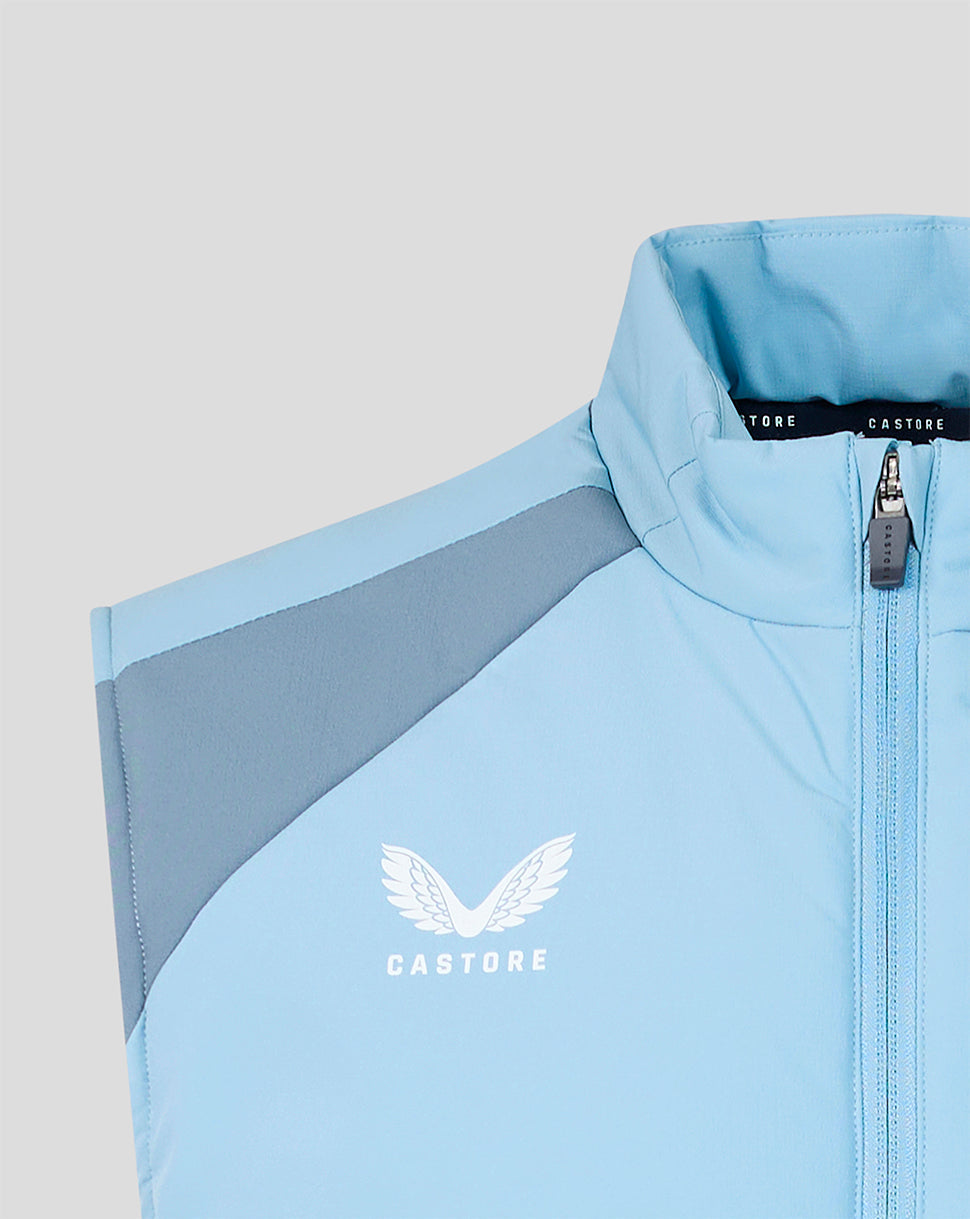 Light blue training gilet with darker shoulder panel, front zipper, and FC Twente crest.