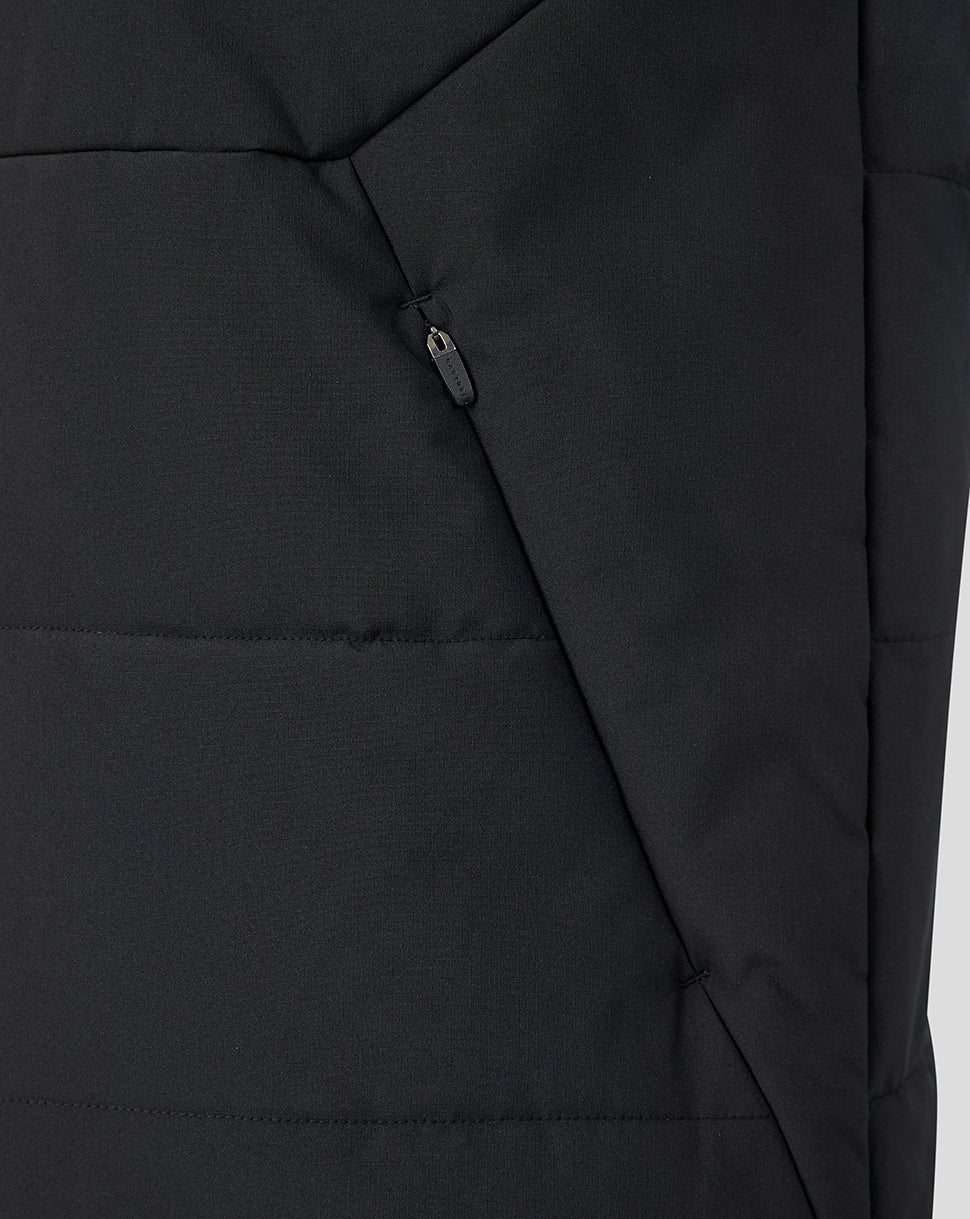 Close up of black padded Feyenoord training coach gilet with diagonal zip pocket