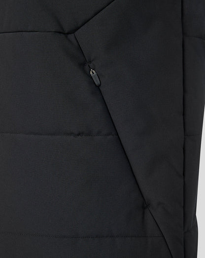 Close up of black padded Feyenoord training coach gilet with diagonal zip pocket