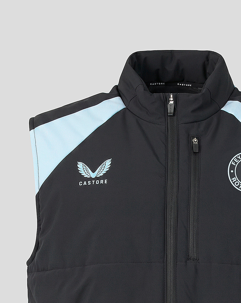 Collar and chest close up showing Castore logo on left chest and Feyenoord crest on right with light blue shoulder stripe