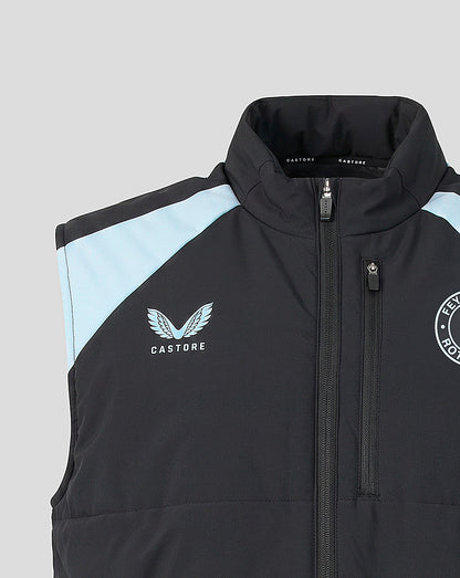 Collar and chest close up showing Castore logo on left chest and Feyenoord crest on right with light blue shoulder stripe