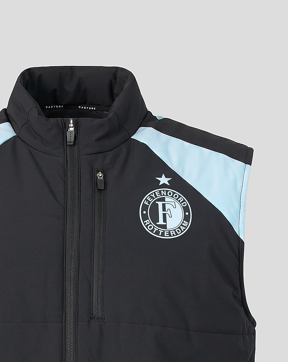 Front close up of black coach gilet with high collar, central zipper, chest zip pocket, Feyenoord crest and light blue shoulder panel