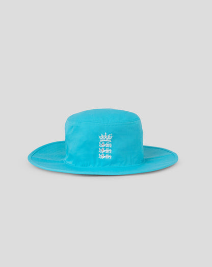 Turquoise bucket hat with a logo on a light gray background