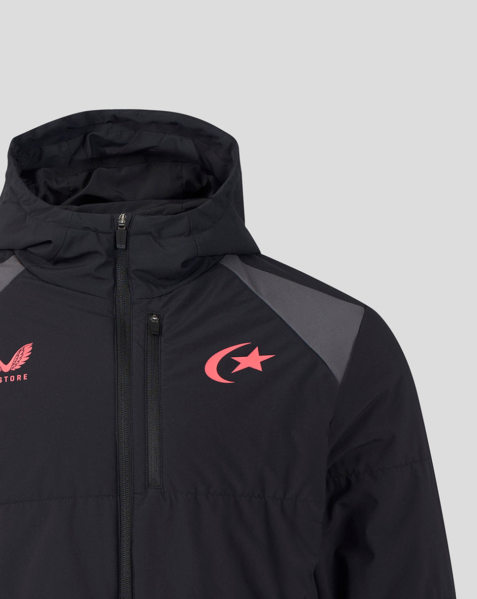 Close-up of a black hooded jacket with a red crescent and star logo on the chest, gray shoulder panels, and a red winged logo on the sleeve, shown against a light gray background.