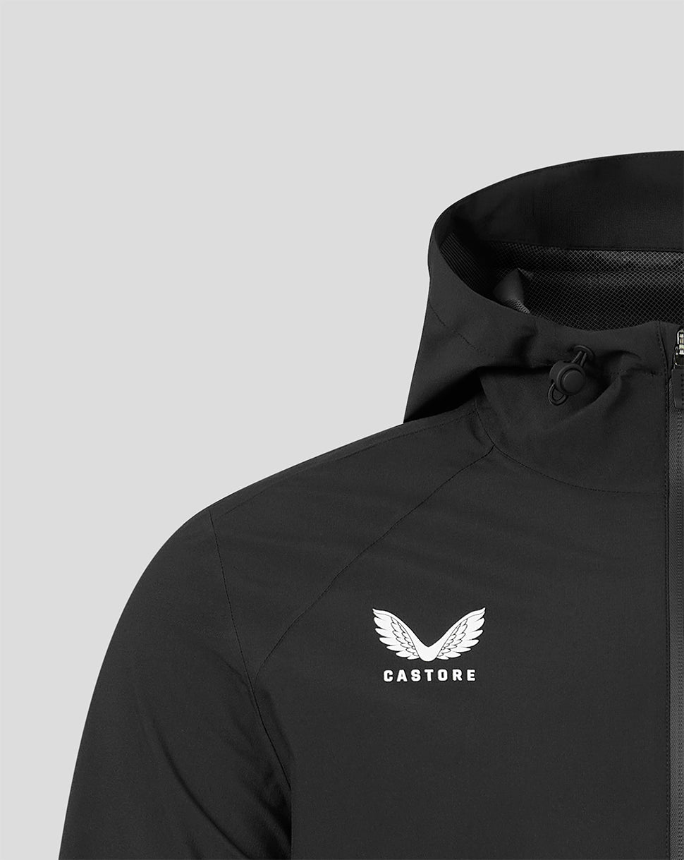 Close-up of a black hooded jacket with a white Castore wing logo and text on the left chest, shown against a light gray background.