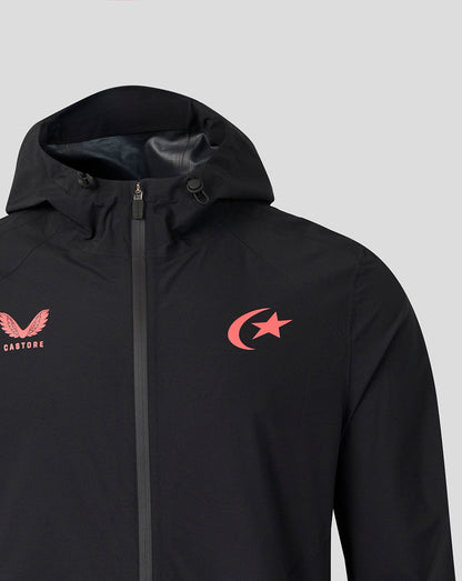 A close-up of a black hooded jacket featuring a red embroidered winged logo with 'CASTORE' text on the left chest and a red crescent and star logo on the right chest, set against a solid light gray background.