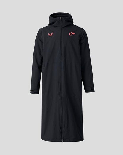 A long black hooded zip-up coat with red embroidered logos on the chest, displayed against a solid light gray background.