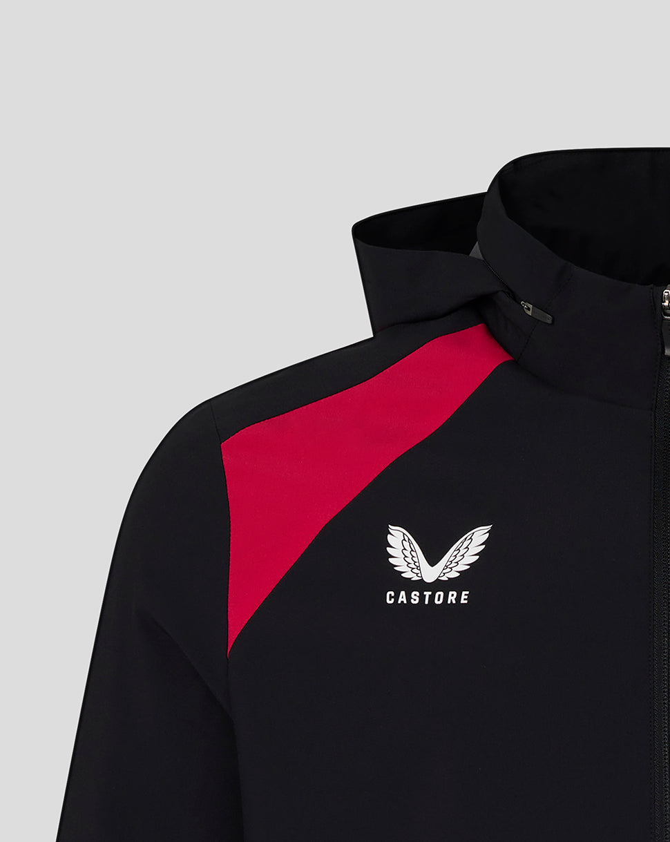 Black jacket with red accents and Castore logo on a light gray background