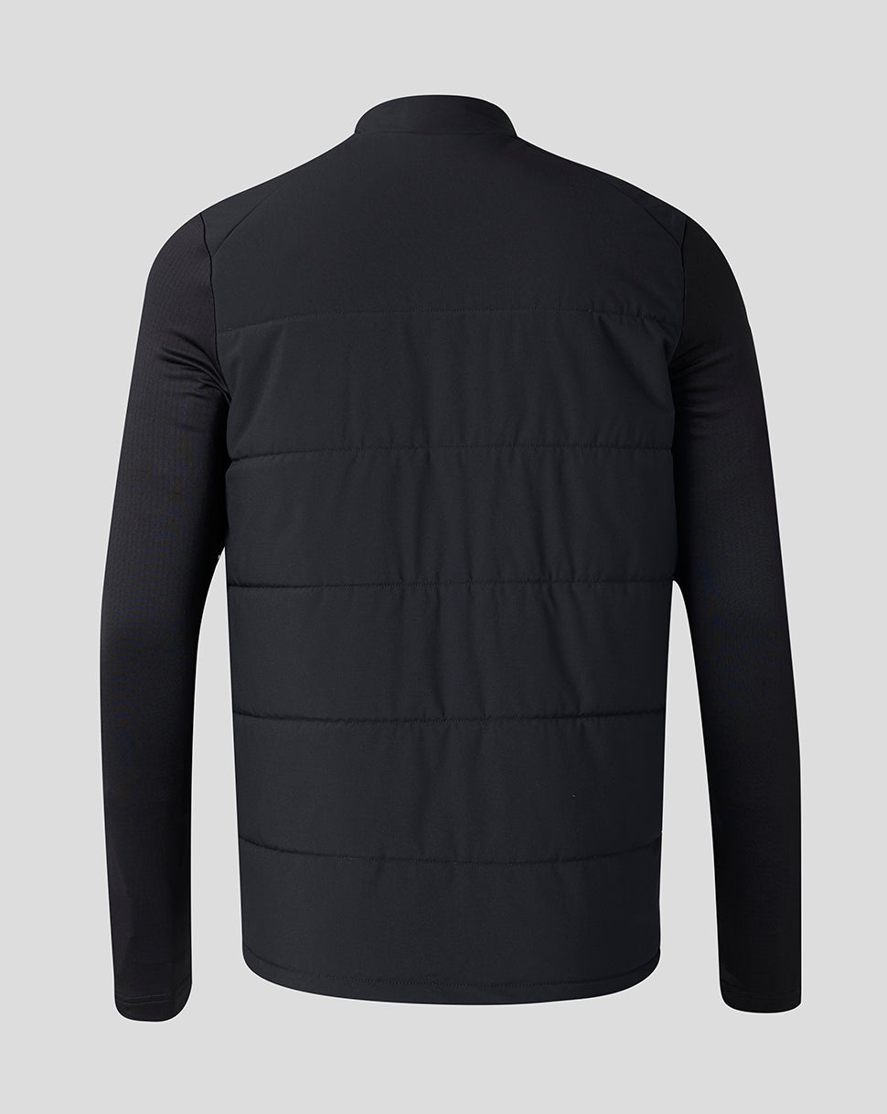 A black long-sleeve puffer jacket with horizontal quilting, shown from the back against a solid light gray background.