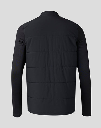 A black long-sleeve puffer jacket with horizontal quilting, shown from the back against a solid light gray background.
