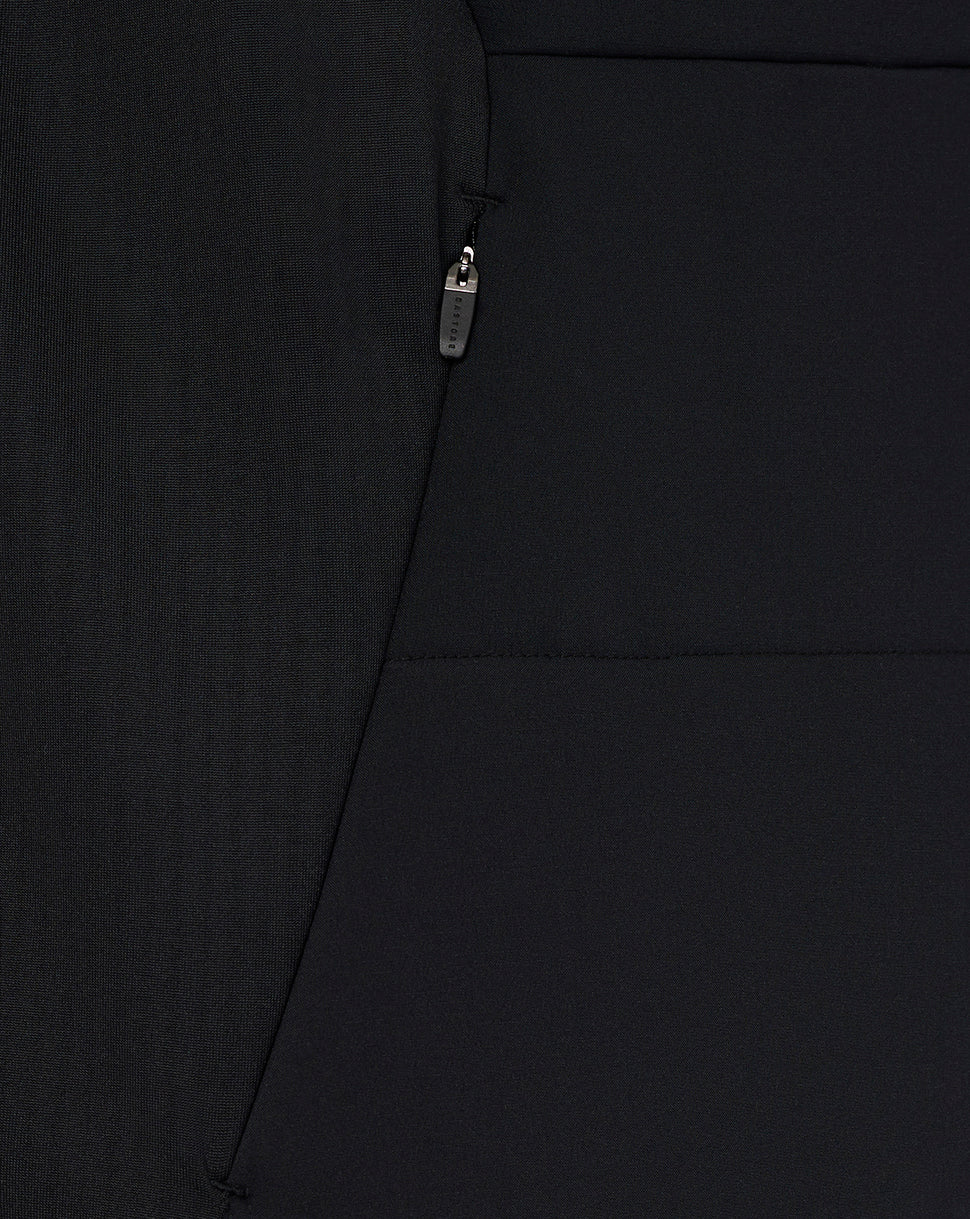 Close-up of a black jacket with a zipper detail on a plain background