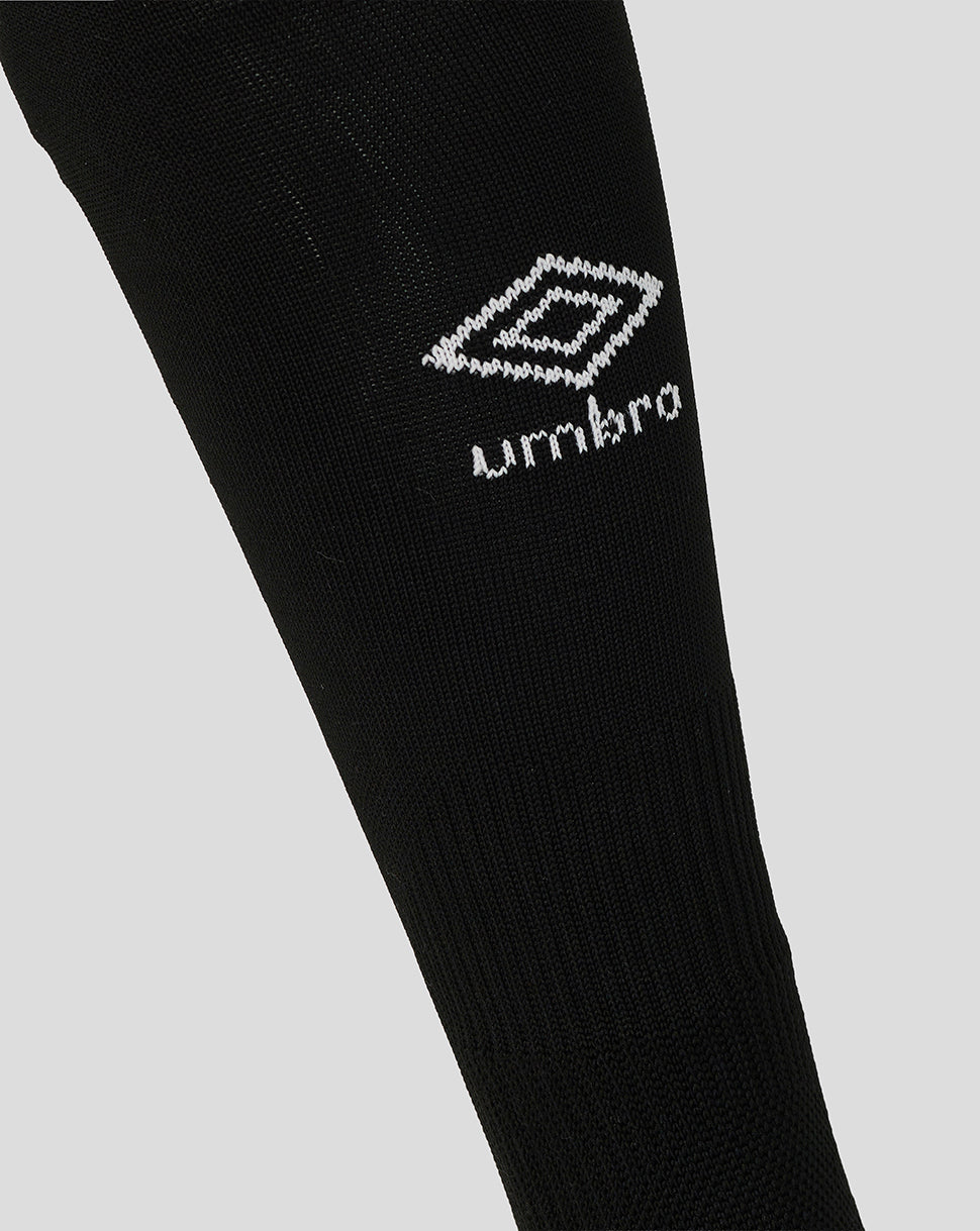 Black sock with Umbro logo on a light gray background
