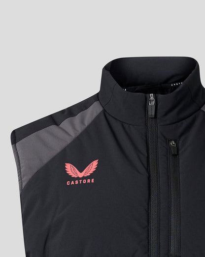 Close-up of a black zip-front vest with a stand collar, gray shoulder panel, and a pink Castore wing logo on the chest, shown against a light gray background.