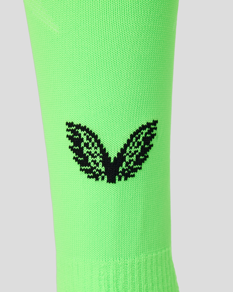 Neon green Feyenoord goalkeeper sock close up with black Castore logo at calf