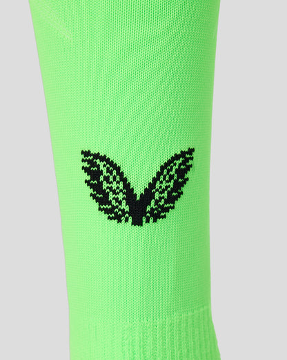 Neon green Feyenoord goalkeeper sock close up with black Castore logo at calf
