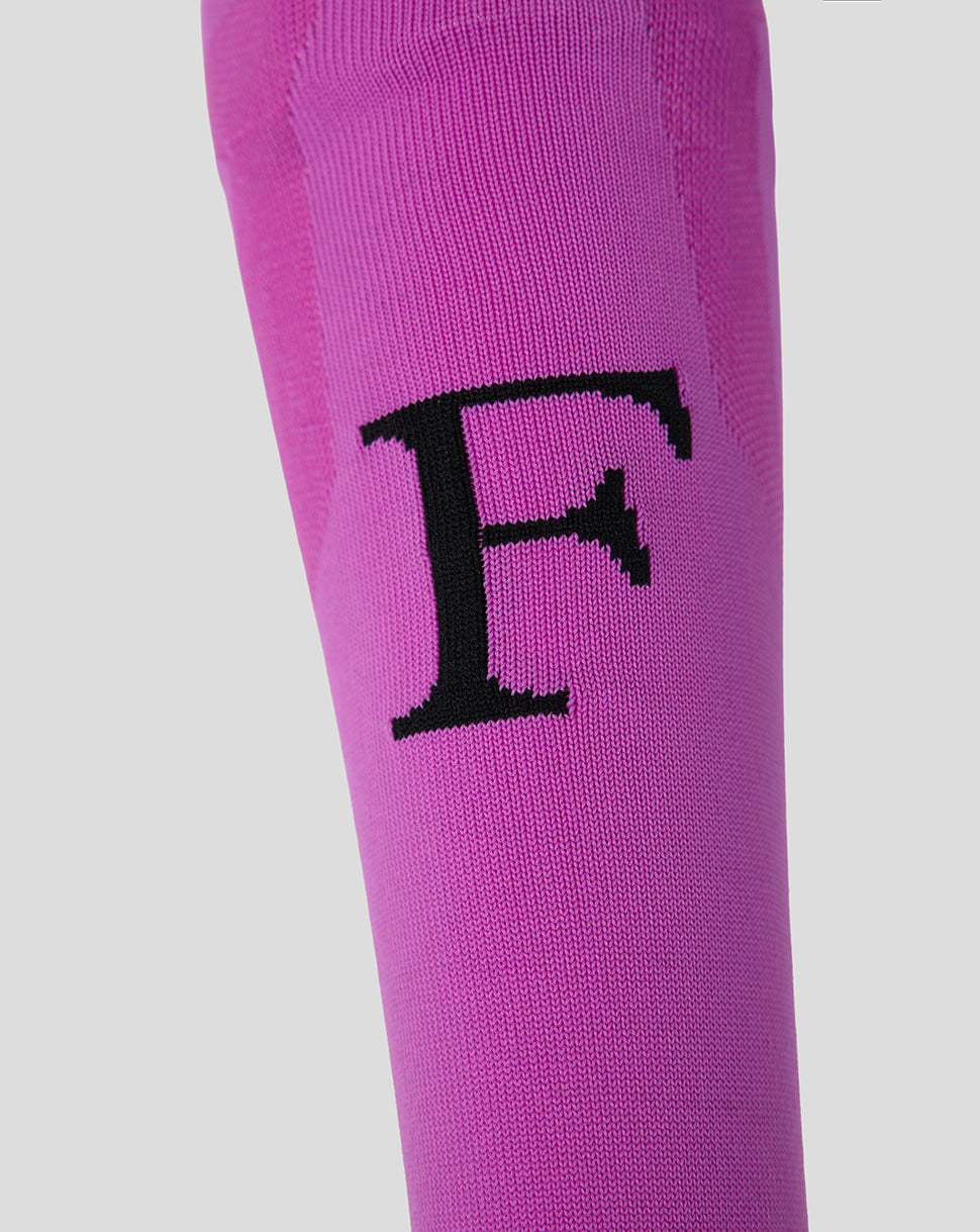 Close up of purple Feyenoord sock displaying bold black F on shin
