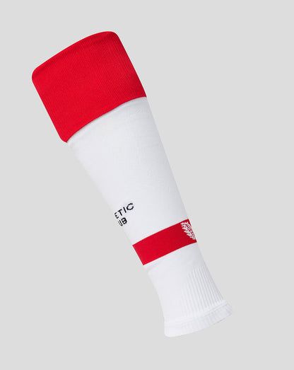 White athletic club home sock with red cuff shown at an angle