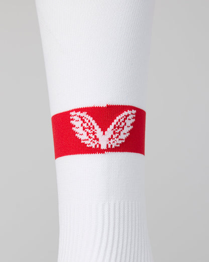 Close-up of white Athletic Club footless sock with a red band and white crest.