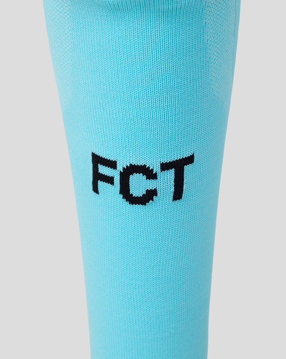 Close-up of turquoise FC Twente Away Goalkeeper Sock showing the FC Twente branding on the leg.