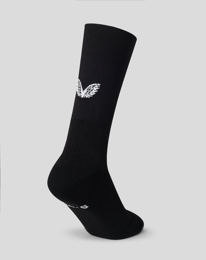 Black sock with a white logo on a light gray background