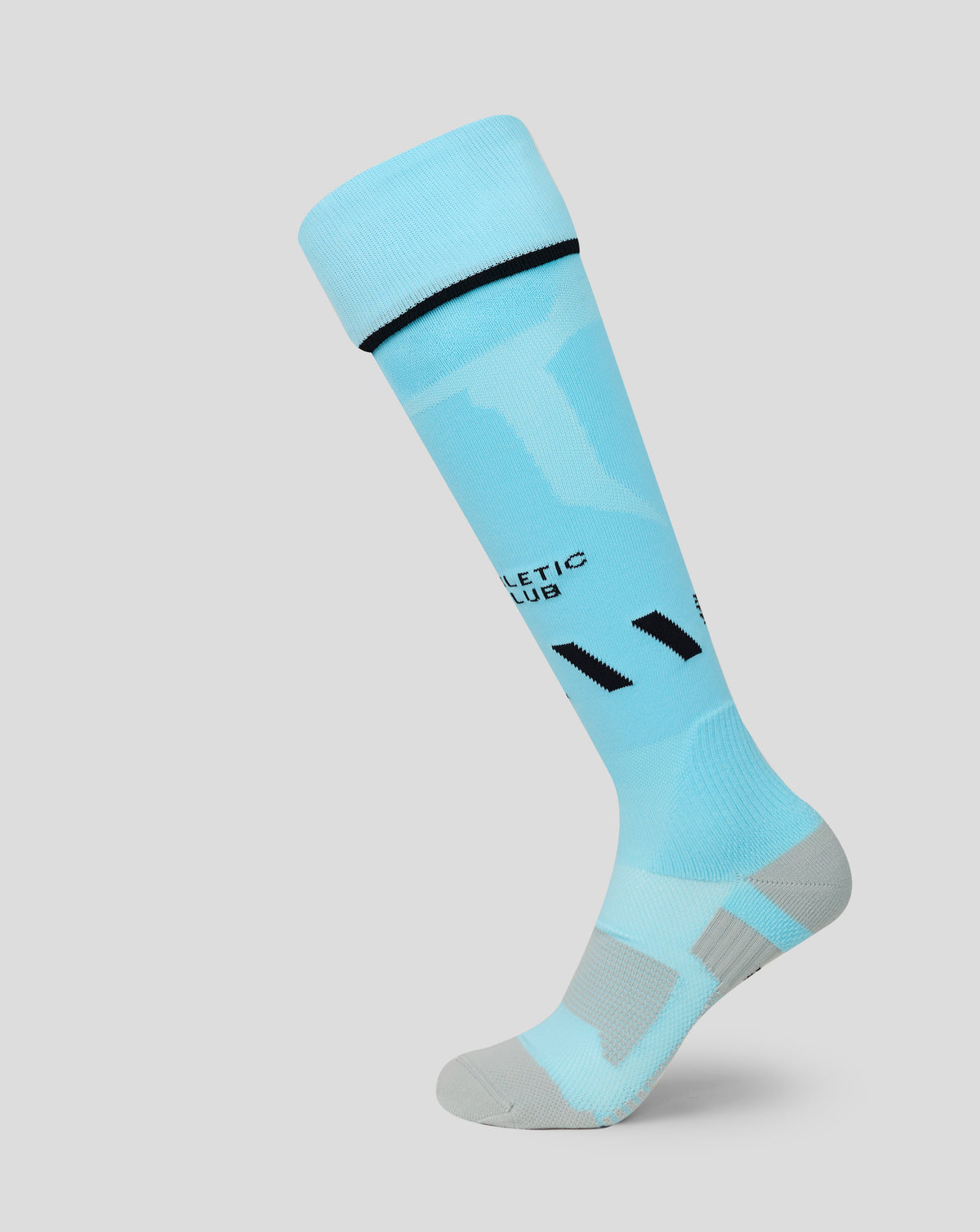 Close-up of a turquoise Athletic Club Junior 26/27 third sock cuff with a black band.