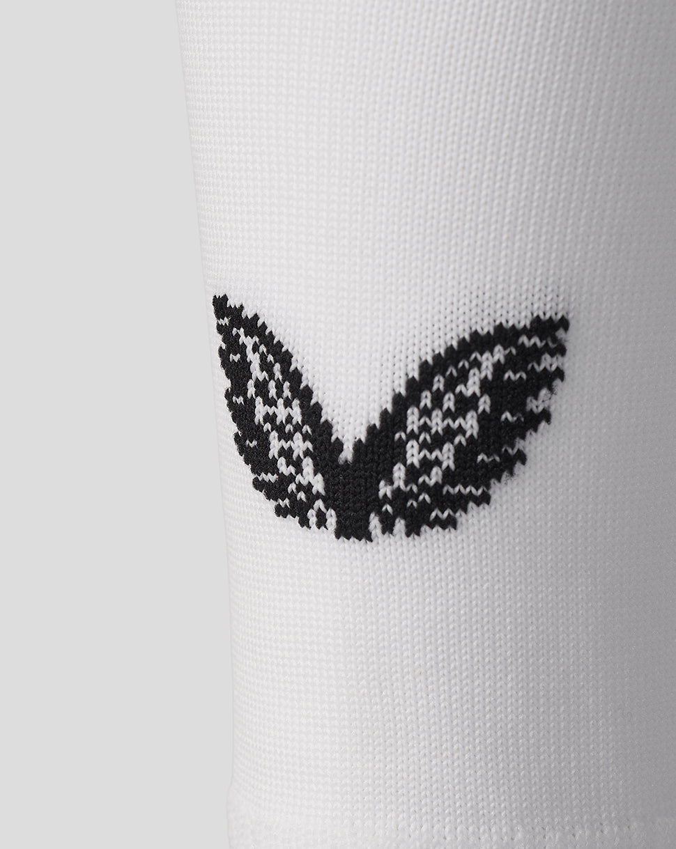 Close-up of white FC Utrecht sock knit showing a black logo pattern