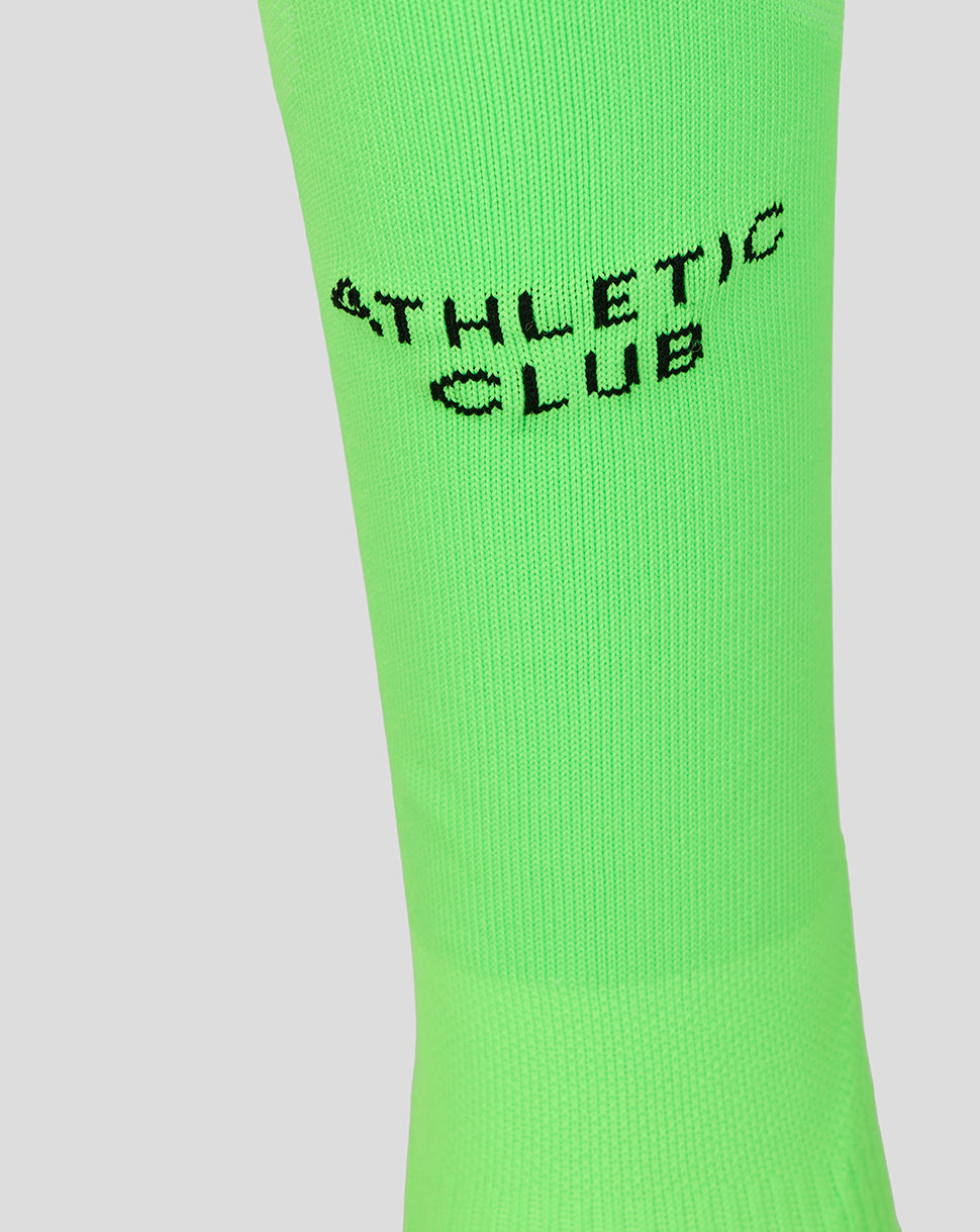 Neon green goalkeeper sock close-up with Athletic Club branding in black