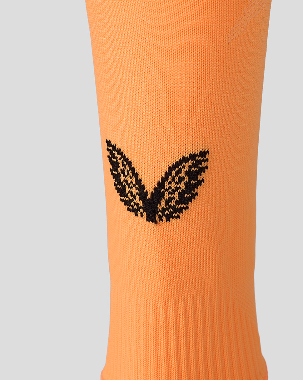 Orange Athletic Club footless sock with a black winged logo on the leg area