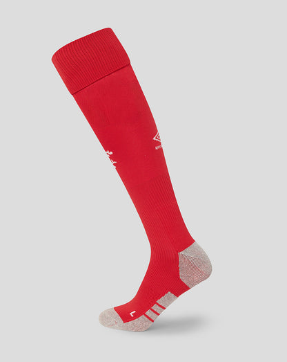 Red knee-high sock with a logo on a light gray background