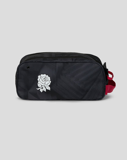 Black toiletry bag with a white rose logo on a light gray background