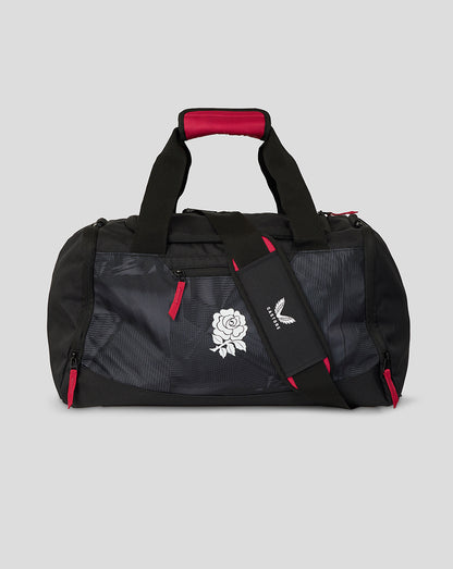 Black duffel bag with red accents and a logo on a gray background