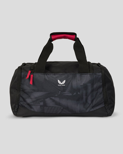 Black duffel bag with red accents on a gray background