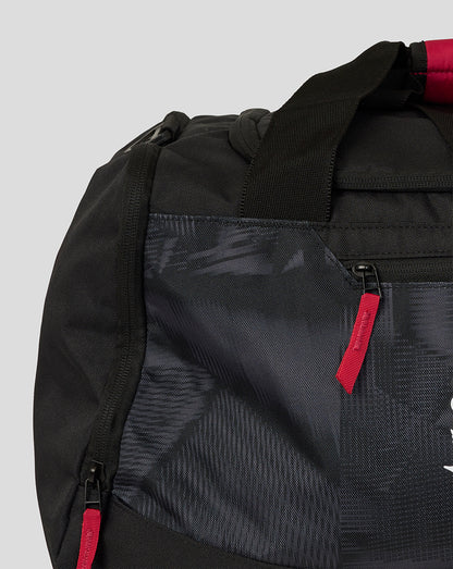 Black backpack with red accents on a light gray background